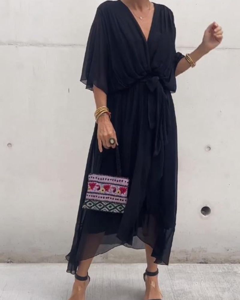 Damesjurk Cristi – Elegante wikkeljurk met vleermuismouwen en asymmetrische zoom