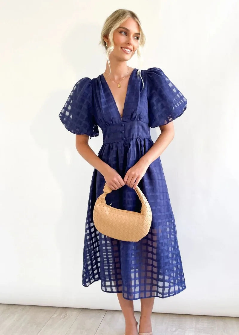 Mylene Robe Midi Femme – Chic ternet kjole med volumen & levende farve